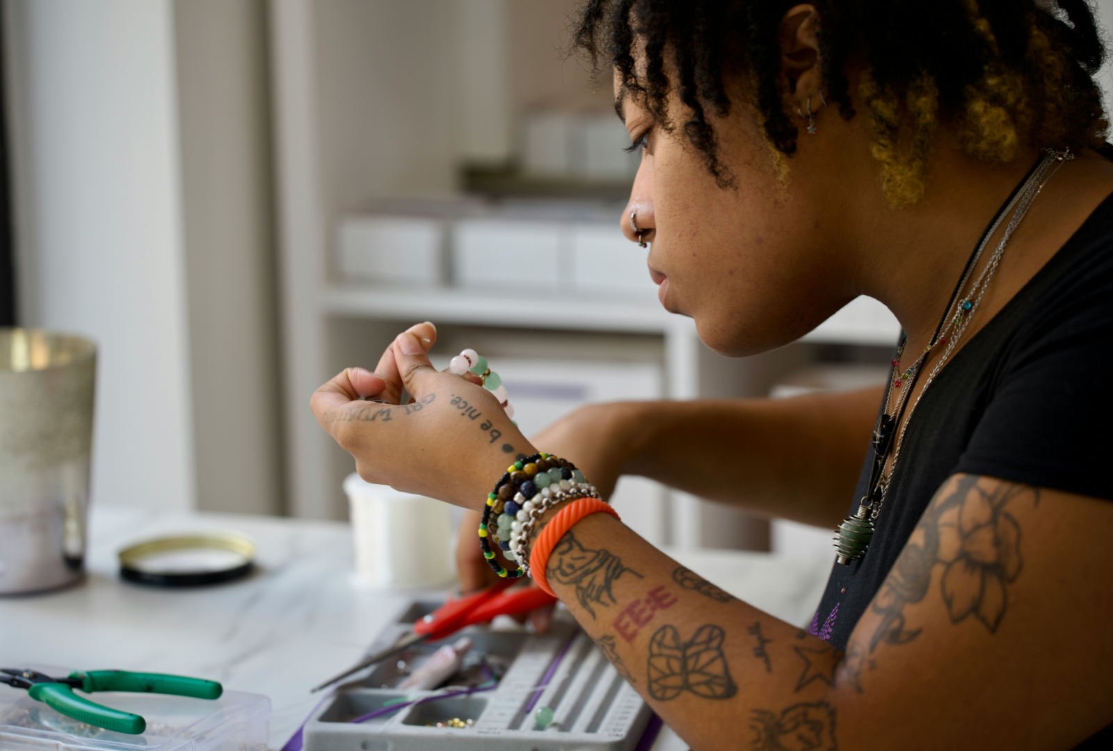 Fine art student working with small materials in a studio, reflecting the process-led approach of a Falmouth Fine Art portfolio.