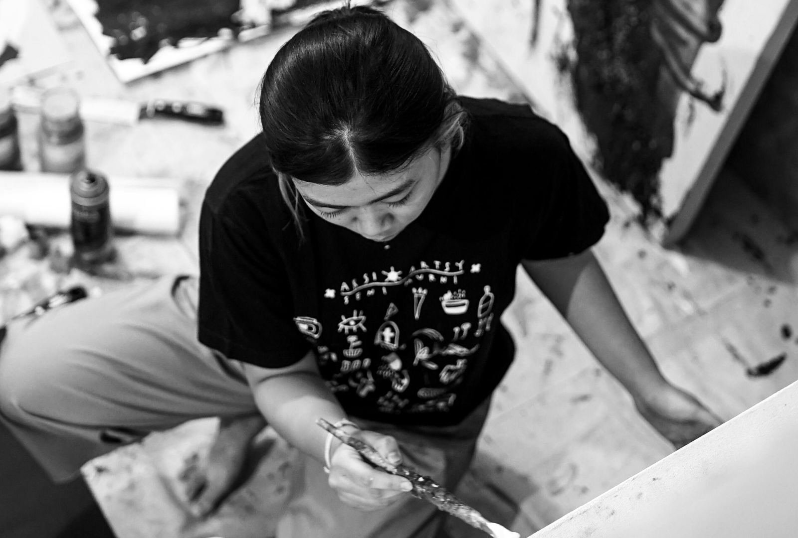 Student painting in a studio, reflecting Pratt BFA Fine Arts portfolio requirements around material practice and observation.