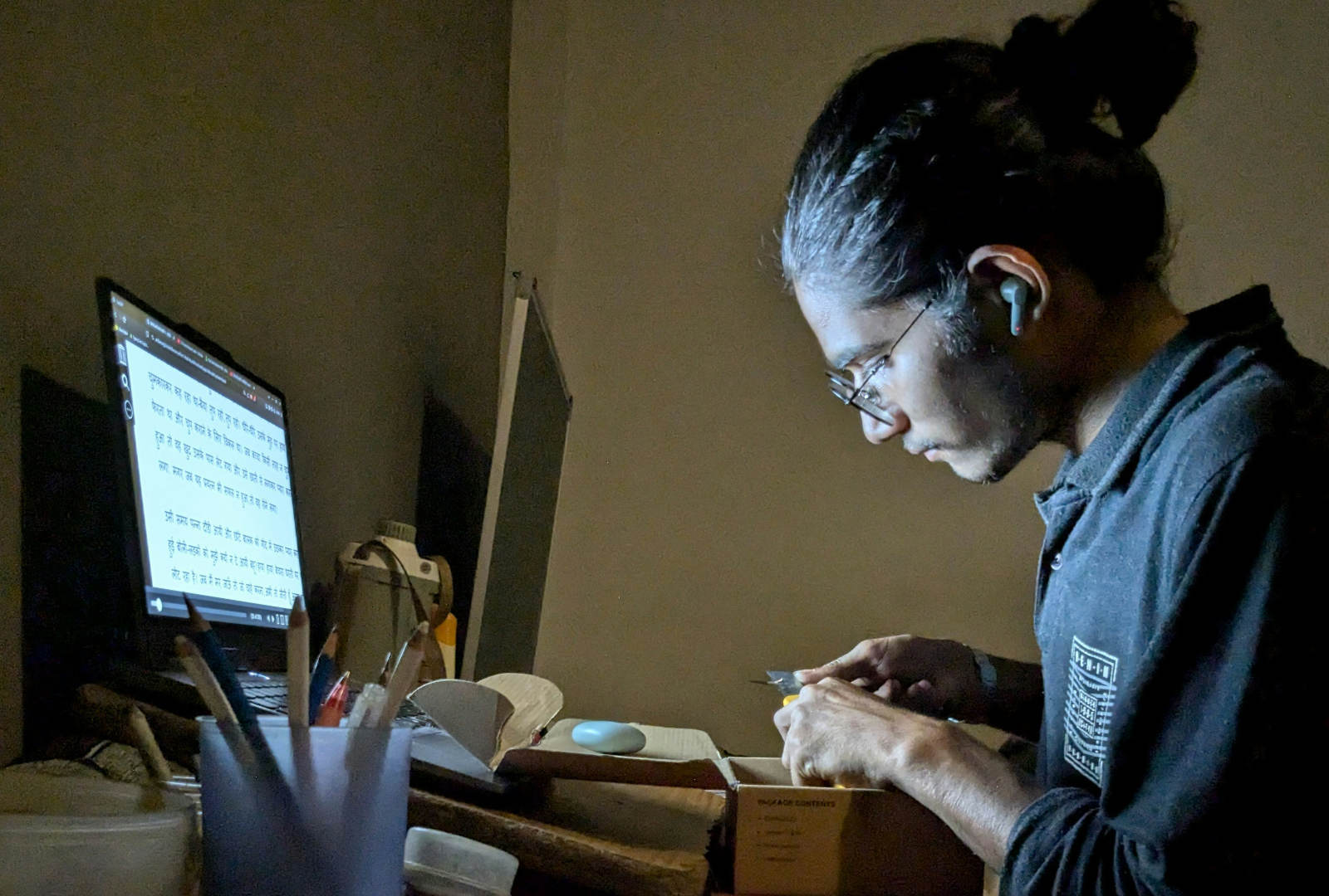 Art school applicant working late on portfolio development for School of Visual Arts BFA Fine Arts admissions.