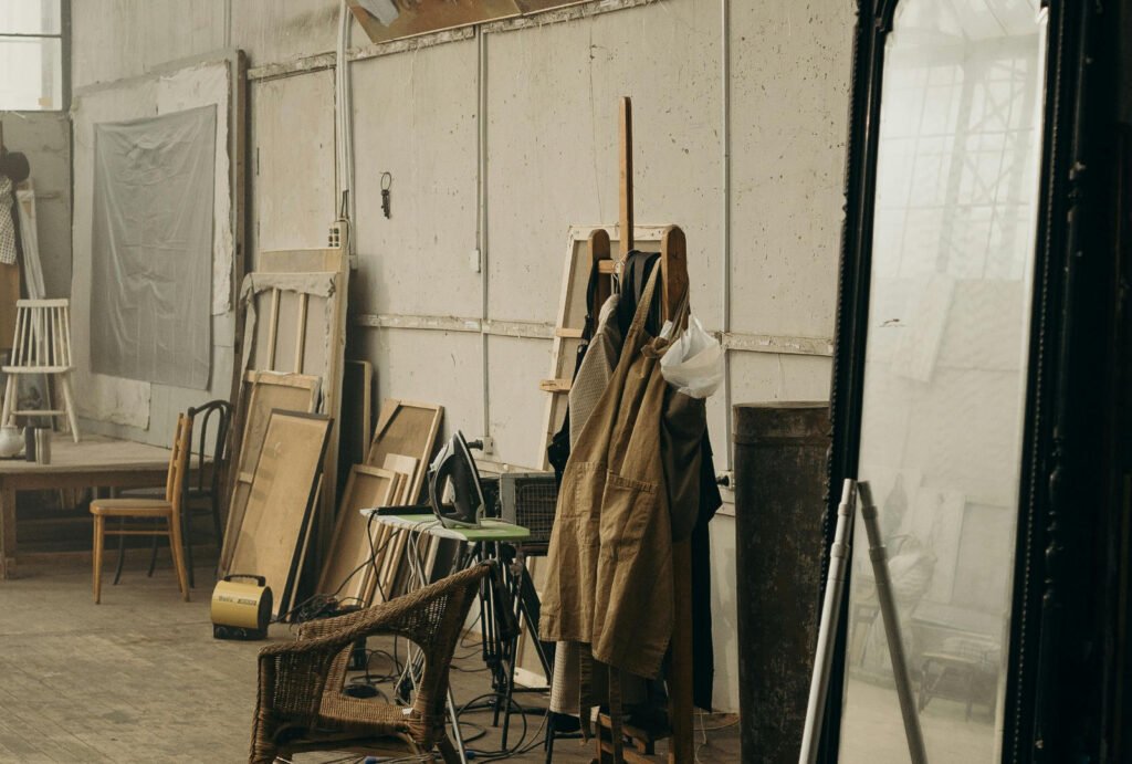 Artist studio with large canvases, easels and painting materials for Yale Painting Printmaking MFA portfolio preparation.