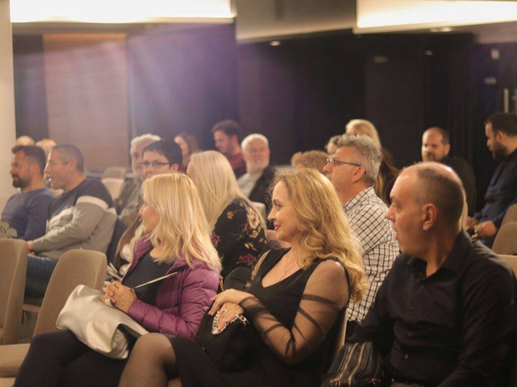 Audience seated in rows at a talk, illustrating an interview about the MA in Art Business at Sotheby’s Institute