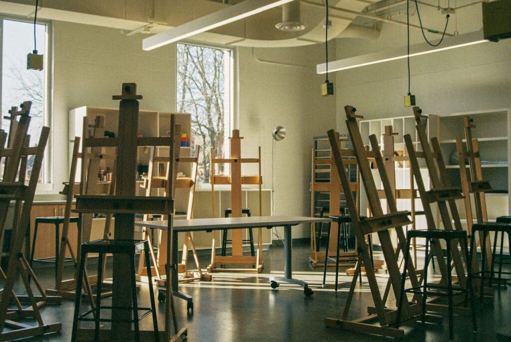 Empty art school studio with easels set in a circle, for applicants working out how to get into top art schools